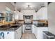 Updated kitchen features stainless steel appliances, modern cabinetry, and granite countertops at 4600 N 68Th St # 313, Scottsdale, AZ 85251