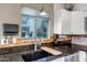 Kitchen features stainless appliances, black granite counters, modern faucet and tile backsplash at 4600 N 68Th St # 313, Scottsdale, AZ 85251