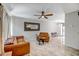 Open floor plan features tile flooring, leather furniture, and ample lighting in this living room at 4600 N 68Th St # 313, Scottsdale, AZ 85251