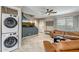 Living room featuring a large leather sofa and a wall-mounted flat screen tv at 4600 N 68Th St # 313, Scottsdale, AZ 85251