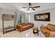 Comfortable living room with leather furnishings, hat rack, tile floors, and contemporary decor at 4600 N 68Th St # 313, Scottsdale, AZ 85251
