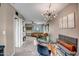 Open-concept living space with dining area, stacked laundry, and leather seating at 4600 N 68Th St # 313, Scottsdale, AZ 85251