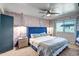 A luxurious main bedroom boasts a tufted headboard, unique wallpaper, and a ceiling fan at 4600 N 68Th St # 313, Scottsdale, AZ 85251