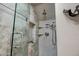 This modern shower features sleek glass doors, convenient shelving, and stylish tile work at 4600 N 68Th St # 313, Scottsdale, AZ 85251