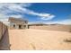Expansive backyard featuring a neutral-toned two-story home and sturdy block fencing for privacy at 5534 W Banff Ln, Glendale, AZ 85306