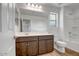 Bathroom with wood-look tile floor, a large mirror, and a tub and shower combination at 5534 W Banff Ln, Glendale, AZ 85306
