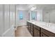 Bathroom featuring double sinks, vanity and tile flooring at 5534 W Banff Ln, Glendale, AZ 85306