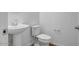 This half-bathroom features a pedestal sink and toilet at 5534 W Banff Ln, Glendale, AZ 85306