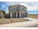 Charming two-story home with a large driveway and gravel landscaping with flower bed at 5534 W Banff Ln, Glendale, AZ 85306