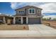Charming two-story home with a large driveway and well-maintained gravel landscaping at 5534 W Banff Ln, Glendale, AZ 85306