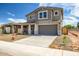 Charming two-story home with a large driveway and minimal landscaping at 5534 W Banff Ln, Glendale, AZ 85306