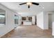 Bright, open living room with wood-style floors and an open layout to the kitchen at 5534 W Banff Ln, Glendale, AZ 85306