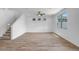 Bright living room with wood floors, large windows, and a ceiling fan at 5534 W Banff Ln, Glendale, AZ 85306