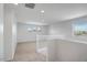 Bright upstairs landing with carpet, white railings and natural light at 5534 W Banff Ln, Glendale, AZ 85306