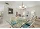 Bright dining area with glass table and wicker chairs at 10726 W Palmeras Dr, Sun City, AZ 85373