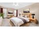 Relaxing main bedroom with a king-size bed and plenty of natural light at 10726 W Palmeras Dr, Sun City, AZ 85373