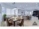 Bright kitchen features an island and breakfast bar; spacious dining area at 1270 E Baranca Rd, Gilbert, AZ 85297