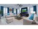 Bright living room featuring modern fireplace, plush sofas, and stylish decor, perfect for relaxation and entertaining at 1270 E Baranca Rd, Gilbert, AZ 85297