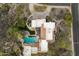 Bird's-eye view of a sprawling estate with a large pool and desert landscaping at 15419 E Stardust Dr, Fountain Hills, AZ 85268