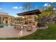 Landscaped backyard with fireplace, seating area, and pool at 15419 E Stardust Dr, Fountain Hills, AZ 85268