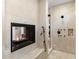 Bathroom with walk-in shower and fireplace at 15419 E Stardust Dr, Fountain Hills, AZ 85268