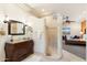 Spa-like bathroom with walk-in shower, double vanity, and views into the bedroom at 15419 E Stardust Dr, Fountain Hills, AZ 85268