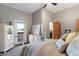 Comfortable bedroom with a queen-size bed, dresser, and access to a private balcony at 15419 E Stardust Dr, Fountain Hills, AZ 85268