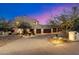 Beautiful two-story home with three-car garage at dusk at 15419 E Stardust Dr, Fountain Hills, AZ 85268
