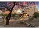 Stunning two-story home with landscaped grounds at sunset at 15419 E Stardust Dr, Fountain Hills, AZ 85268