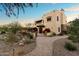 Luxury home exterior with walkway, landscaping and sunset views at 15419 E Stardust Dr, Fountain Hills, AZ 85268