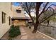 Landscaped front yard with stone walkway and mature trees at 15419 E Stardust Dr, Fountain Hills, AZ 85268