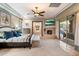 Luxurious main bedroom with fireplace, TV, and private patio access at 15419 E Stardust Dr, Fountain Hills, AZ 85268