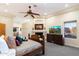 Spacious main bedroom with a fireplace, a king-size bed, and views at 15419 E Stardust Dr, Fountain Hills, AZ 85268