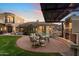 Relaxing patio with fireplace, seating area, and pergola at 15419 E Stardust Dr, Fountain Hills, AZ 85268