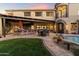 Outdoor kitchen and dining area with a pergola at 15419 E Stardust Dr, Fountain Hills, AZ 85268