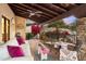 Covered patio with comfortable seating and beautiful desert views at 15419 E Stardust Dr, Fountain Hills, AZ 85268