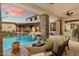 Relaxing patio with comfortable seating overlooking the stunning pool at 15419 E Stardust Dr, Fountain Hills, AZ 85268