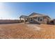 Spacious backyard with covered patio, offering a relaxing outdoor area at 21615 N Daniel Dr, Maricopa, AZ 85138