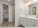Double vanity bathroom with a walk in shower at 21615 N Daniel Dr, Maricopa, AZ 85138