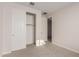 Bedroom with white doors and neutral walls at 21615 N Daniel Dr, Maricopa, AZ 85138