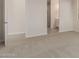 Bedroom with carpet flooring and access to the bathroom at 21615 N Daniel Dr, Maricopa, AZ 85138