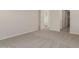 Spacious bedroom with carpet and access to bathroom at 21615 N Daniel Dr, Maricopa, AZ 85138