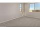Bright bedroom with neutral wall and carpet at 21615 N Daniel Dr, Maricopa, AZ 85138