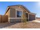 House exterior view, featuring a two-car garage and a stone facade at 21615 N Daniel Dr, Maricopa, AZ 85138