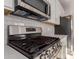 Stainless steel gas range with griddle at 21615 N Daniel Dr, Maricopa, AZ 85138