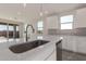 Modern kitchen sink and faucet with quartz countertops at 21615 N Daniel Dr, Maricopa, AZ 85138