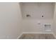 Laundry room with hookups and built in shelving at 21615 N Daniel Dr, Maricopa, AZ 85138