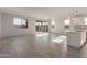 Spacious living room with tile floors and sliding glass doors at 21615 N Daniel Dr, Maricopa, AZ 85138