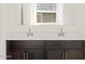This bathroom has double sinks with a view at 22489 W Pontiac Dr, Surprise, AZ 85387