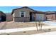 Charming single-story home featuring a two-car garage and low-maintenance front yard at 22489 W Pontiac Dr, Surprise, AZ 85387